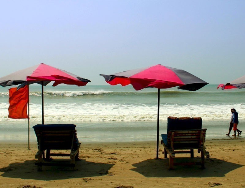 Row of sunshade and deck chairs on Cox's Bazar Beach in Bangladesh | 10 Spectacular Places to Visit Before They Become Famous