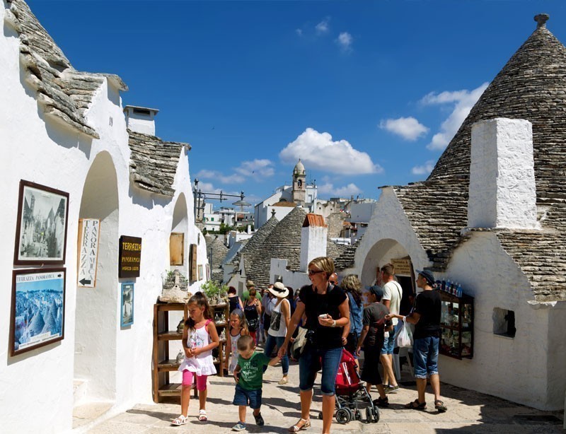 Stroll among Trulli houses in Alberobello. The Trulli of Alberobello is a UNESCO World Heritage site | 10 Spectacular Places to Visit Before They Become Famous
