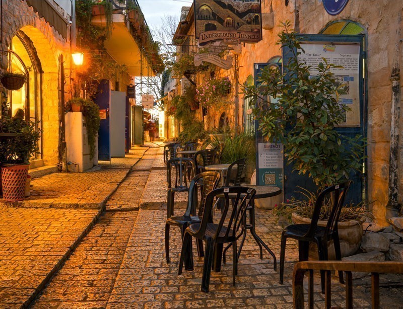 Sunset scene in an alley in the Jewish quarter, with local businesses, in Safed (Tzfat), Israel | 10 Spectacular Places to Visit Before They Become Famous